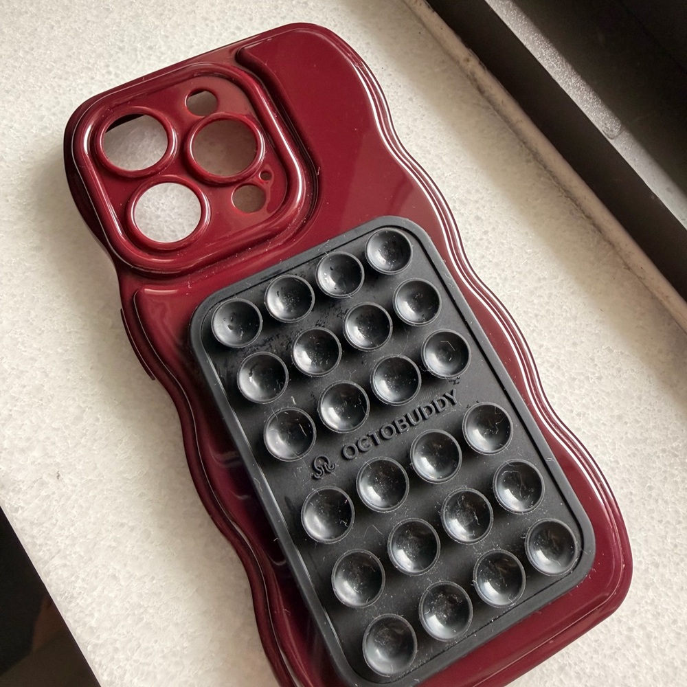 Burgundy iPhone 15 pro case with black octobuddy